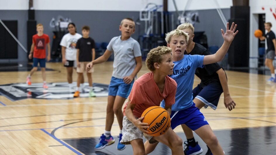 Young basketball players competing in a live group training session on the courts at Training Zone in Herriman, Utah
